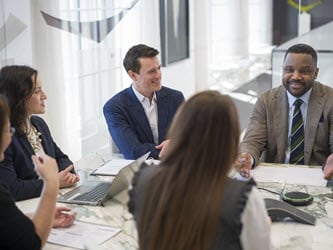 Attorneys sitting at conference room table