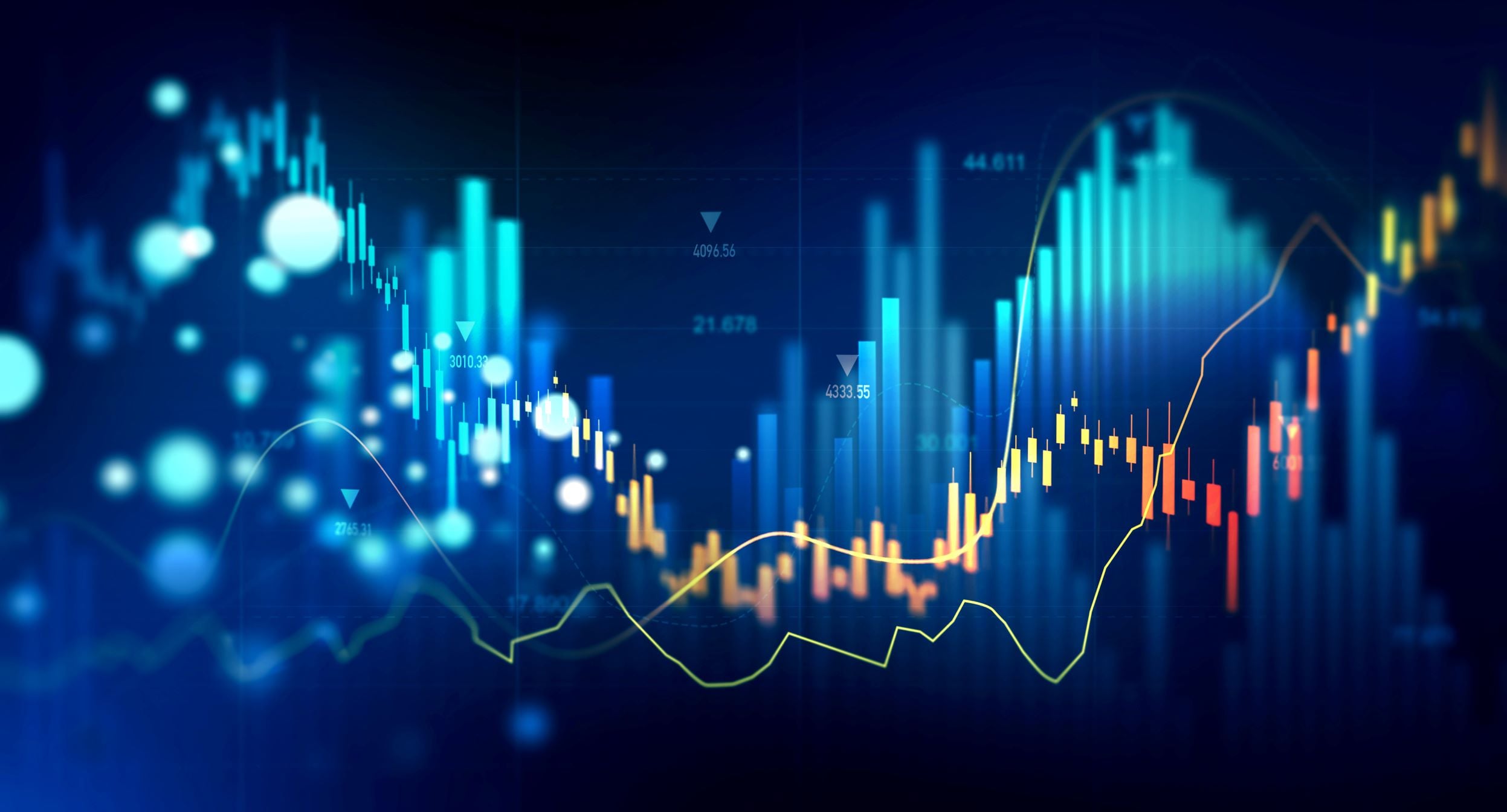 Unlabeled financial chart bars and graphs of light blue and yellow coloring overlaying one another upon a dark blue background.
